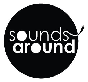 Logo for Sounds Around with a coaxial cable extending off the final s in sounds and extending beyond  the circle containing the words.